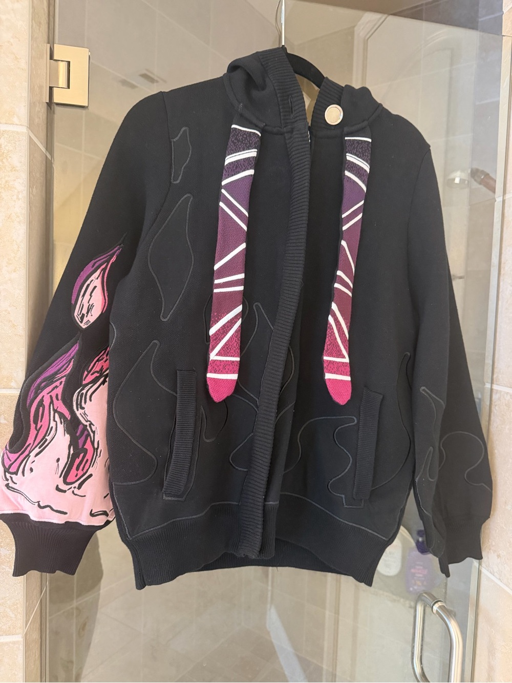 Black Hoodie Puffer with Pink Flame Sleeve and Patterned Drawstrings
